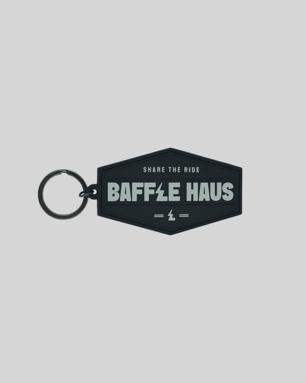Baffle Haus black embossed PVC retro key tag with debossed logo and durable split-ring fitting
