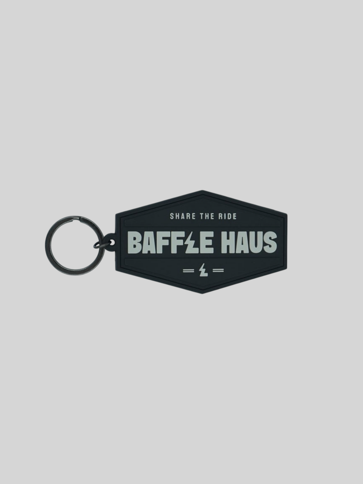 Baffle Haus black embossed PVC retro key tag with debossed logo and durable split-ring fitting