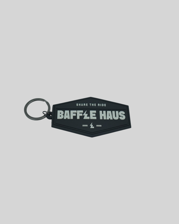 Baffle Haus black embossed PVC retro key tag with white debossed logo and metal split-ring keyring