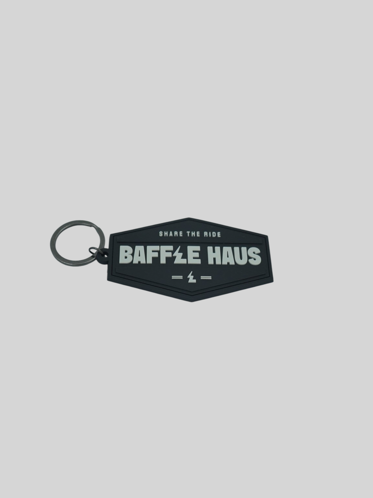 Baffle Haus black embossed PVC retro key tag with white debossed logo and metal split-ring keyring