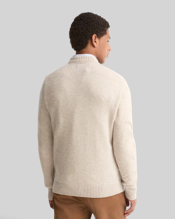 Baffle Haus Barbour light grey lambswool crew neck jumper worn by a man, back view showing ribbed hem and collar
