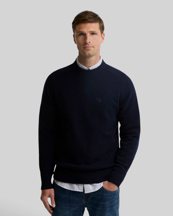 Baffle Haus Barbour Newtown navy lambswool crew neck jumper worn by a male model over a light shirt