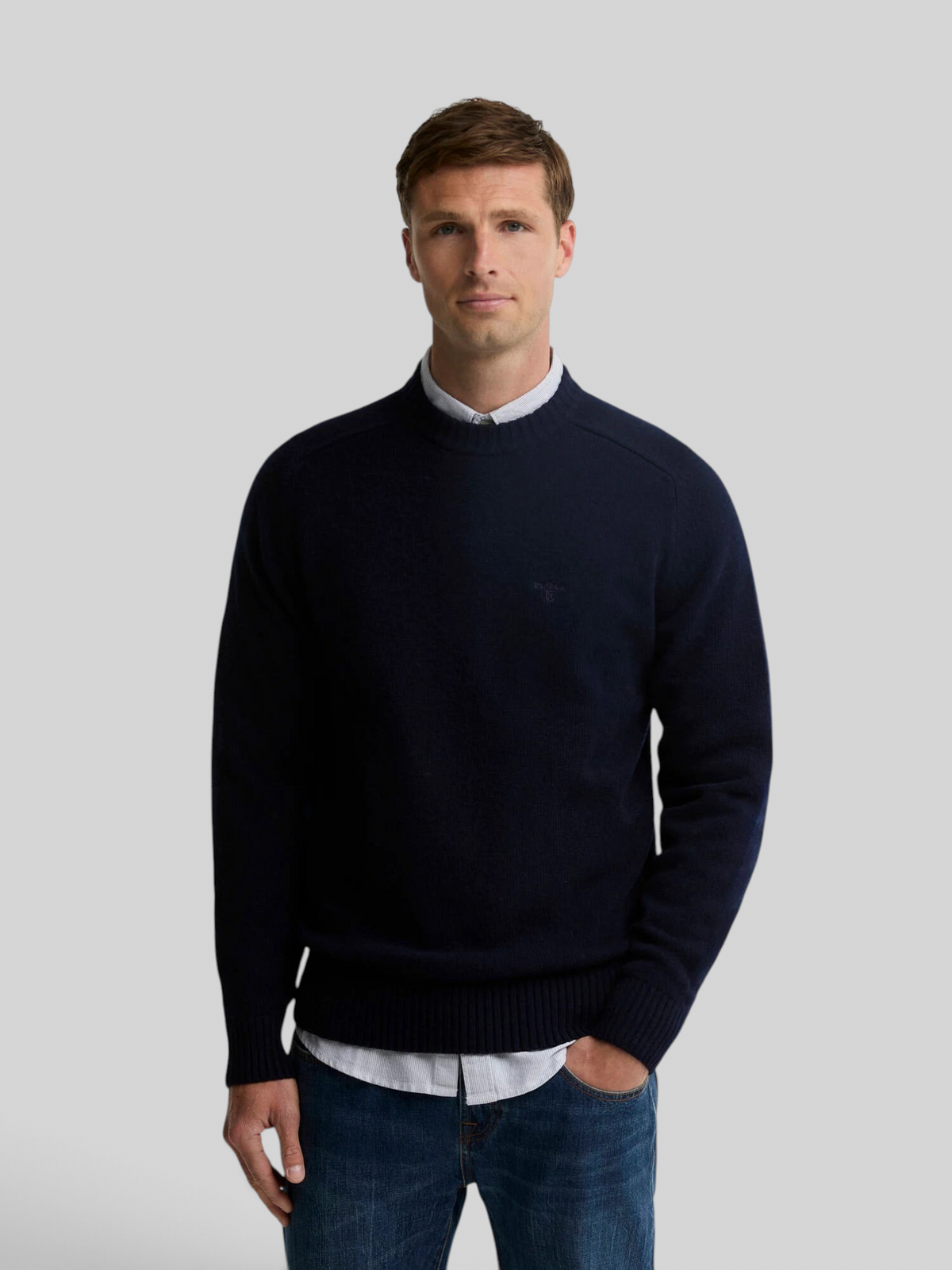 Baffle Haus Barbour Newtown navy lambswool crew neck jumper worn by a male model over a light shirt