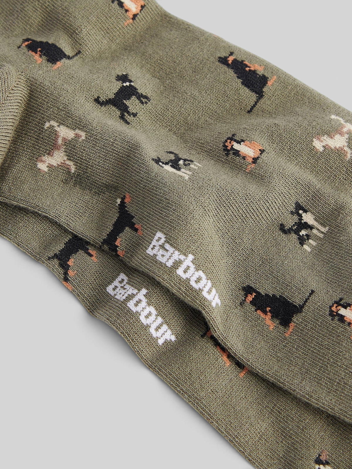 Baffle Haus Barbour Mavin ankle socks in mid olive with a novelty dog intarsia knit pattern and ribbed cuffs