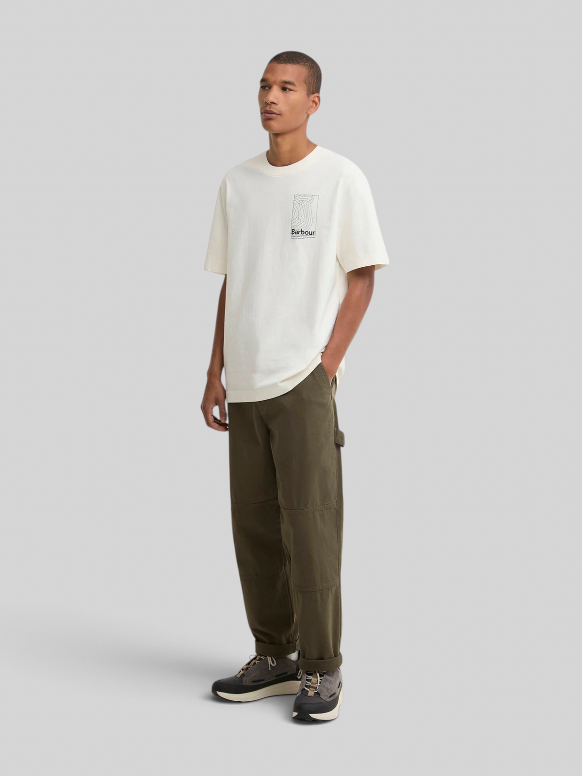 Model wearing a Baffle Haus Barbour Woodbine relaxed fit whisper white cotton t-shirt with chest logo