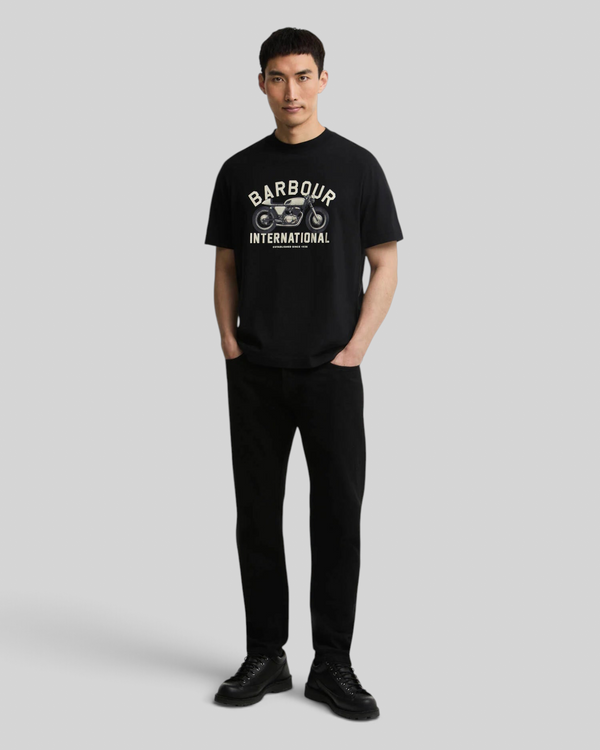 Model wearing Baffle Haus black cotton Eric graphic t-shirt with motorcycle print, relaxed fit and ribbed collar.