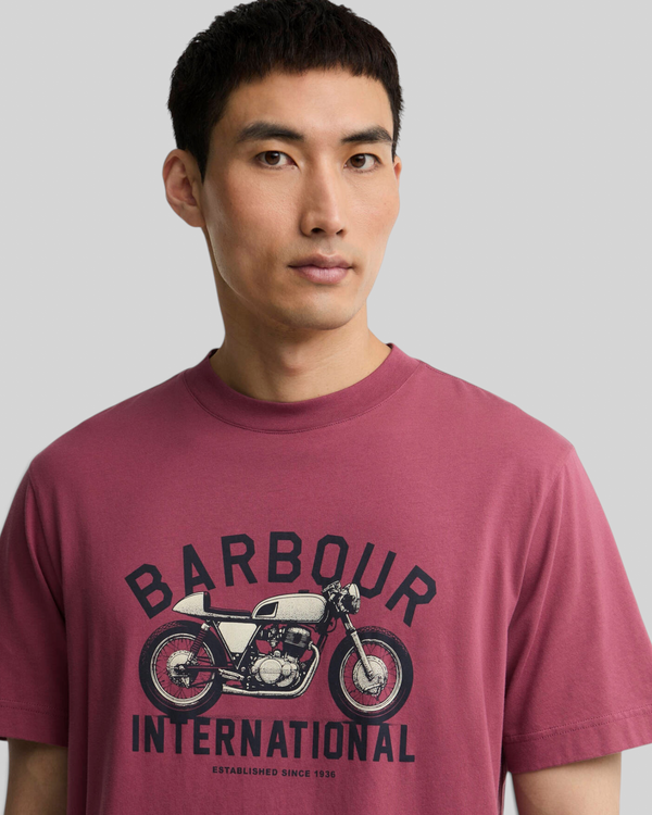 Baffle Haus maroon cotton t-shirt featuring a vintage motorcycle graphic on the chest worn by a male model