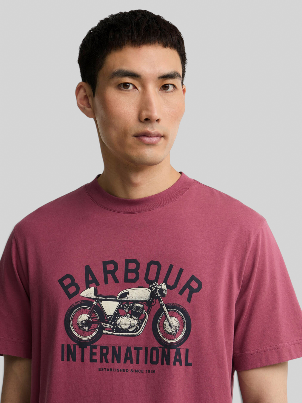 Baffle Haus maroon cotton t-shirt featuring a vintage motorcycle graphic on the chest worn by a male model