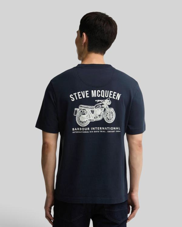 Baffle Haus navy cotton t-shirt with Steve McQueen motorcycle graphic print on the back worn by a man