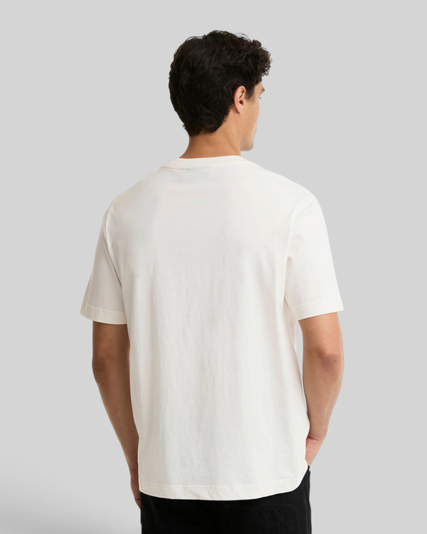 Back view of a man wearing a Baffle Haus Barbour International Triton cotton T-shirt in whisper white
