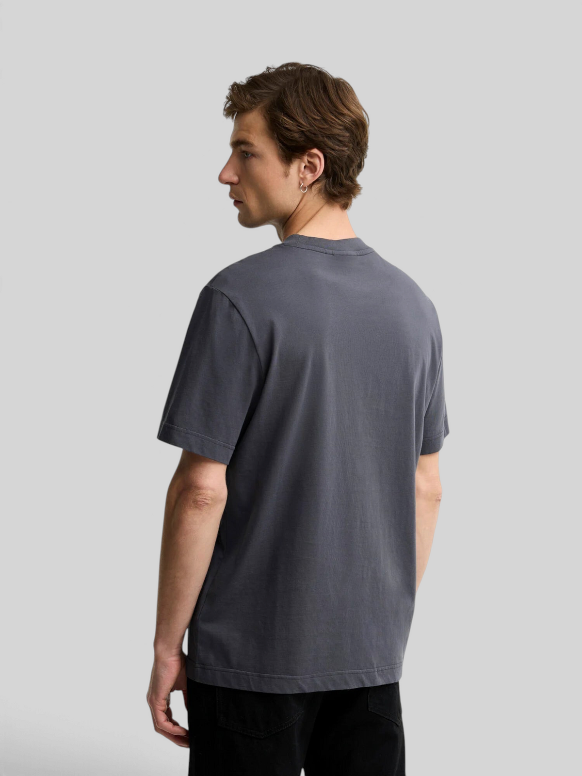 Baffle Haus Barbour International Causey graphic t-shirt in asphalt grey cotton jersey, back view on a male model.