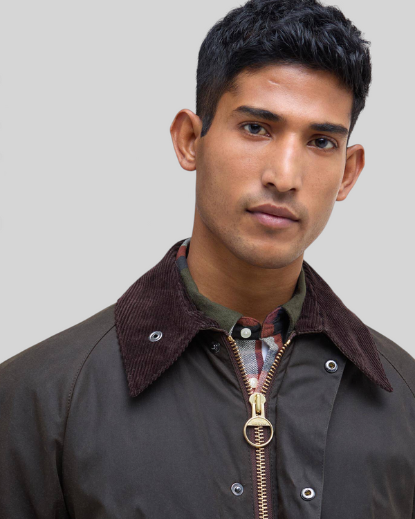 Baffle Haus Barbour Bedale olive waxed cotton jacket featuring a brown corduroy collar and gold two-way front zip.