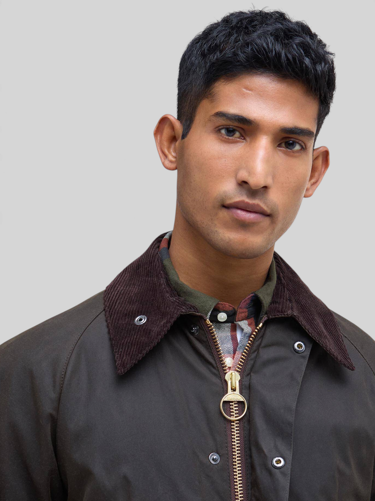 Baffle Haus Barbour Bedale olive waxed cotton jacket featuring a brown corduroy collar and gold two-way front zip.