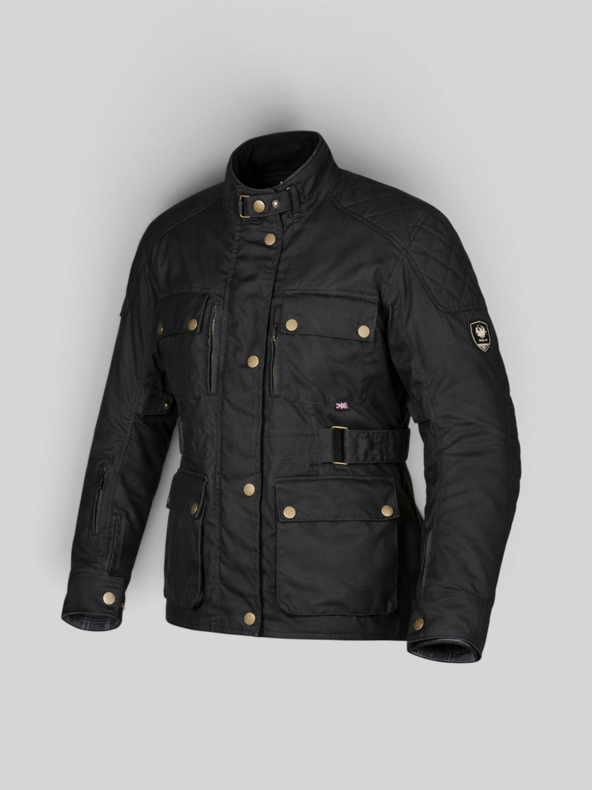 Baffle Haus Hartwell black waxed cotton motorcycle jacket with quilted shoulders, brass hardware, and belted waist.