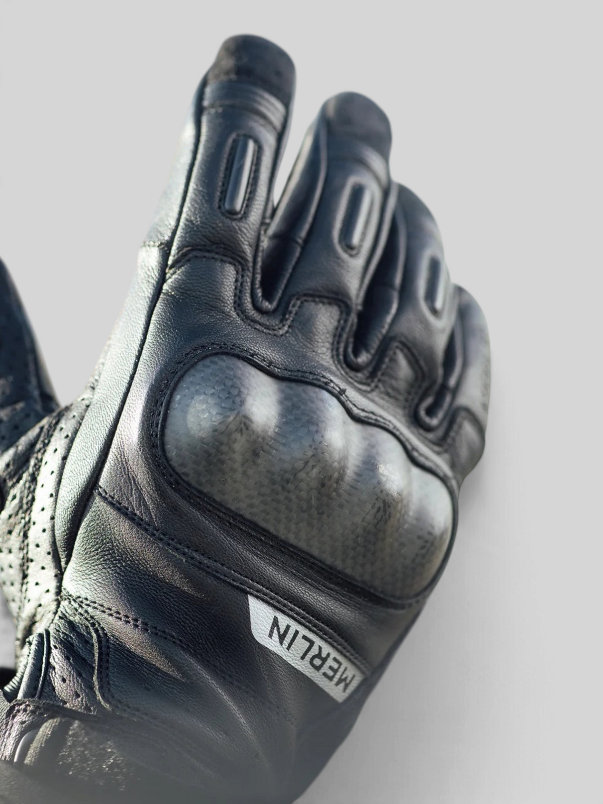 Baffle Haus Overland Air D3O motorcycle glove in black goatskin leather with carbon fiber knuckle protection.