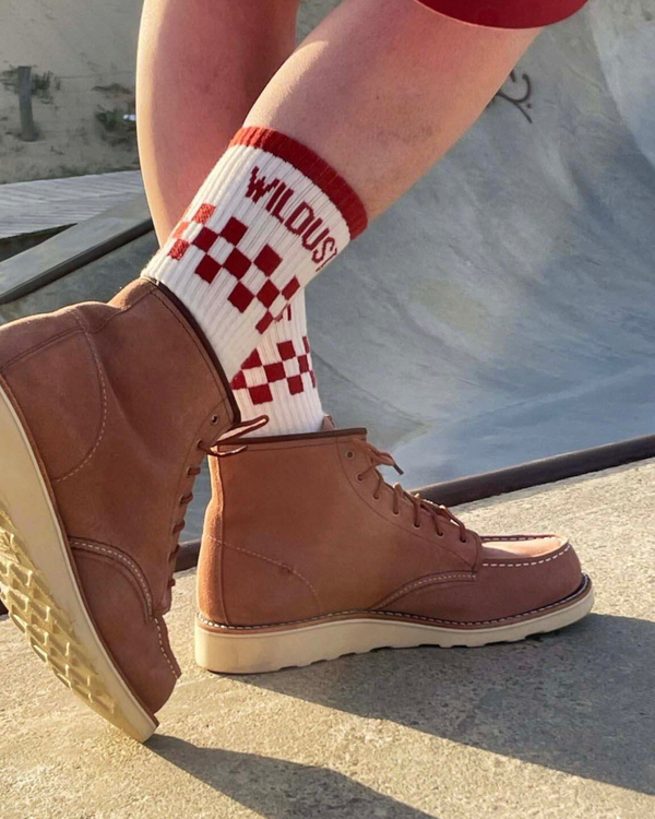 Baffle Haus brick red and white checkered race socks with double-fleece base worn with brown suede leather boots