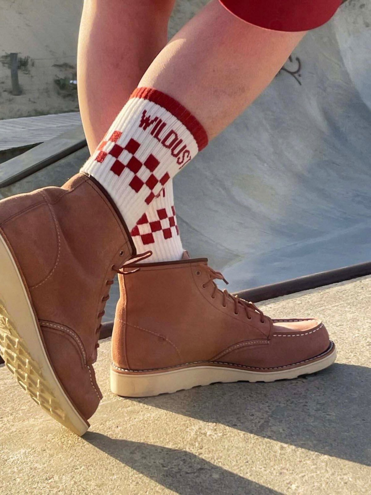 Baffle Haus brick red and white checkered race socks with double-fleece base worn with brown suede leather boots