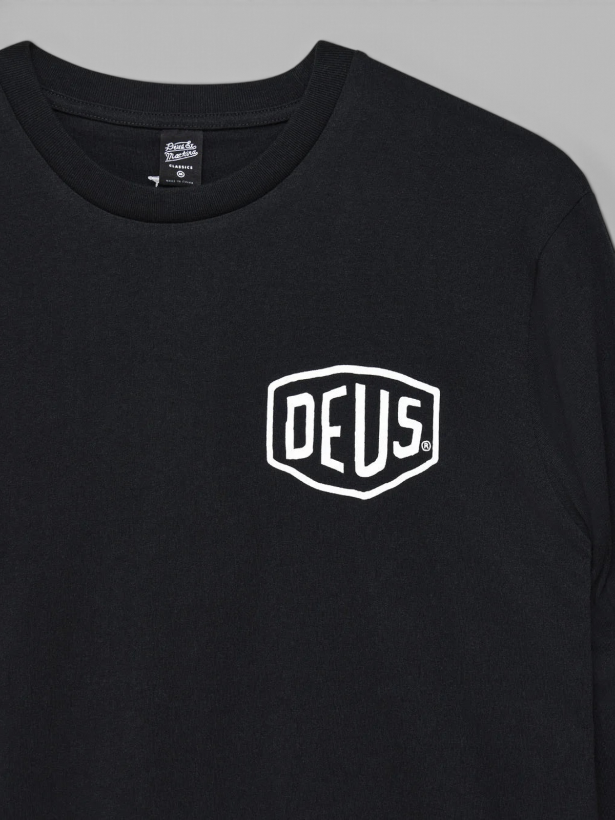 Baffle Haus Harajuku LS Tee in black recycled cotton jersey with white Deus chest logo print