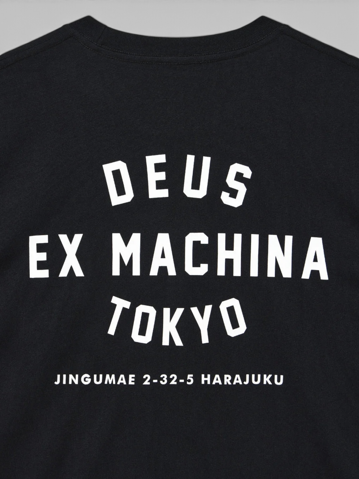 Baffle Haus black long sleeve t-shirt featuring white Deus Ex Machina Tokyo Harajuku graphic print on the back