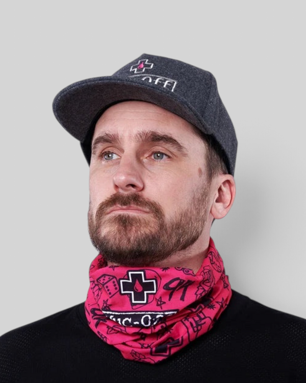 Baffle Haus pink punk neck tube gaiter worn by a man in a grey cap, featuring a seamless polyester design.