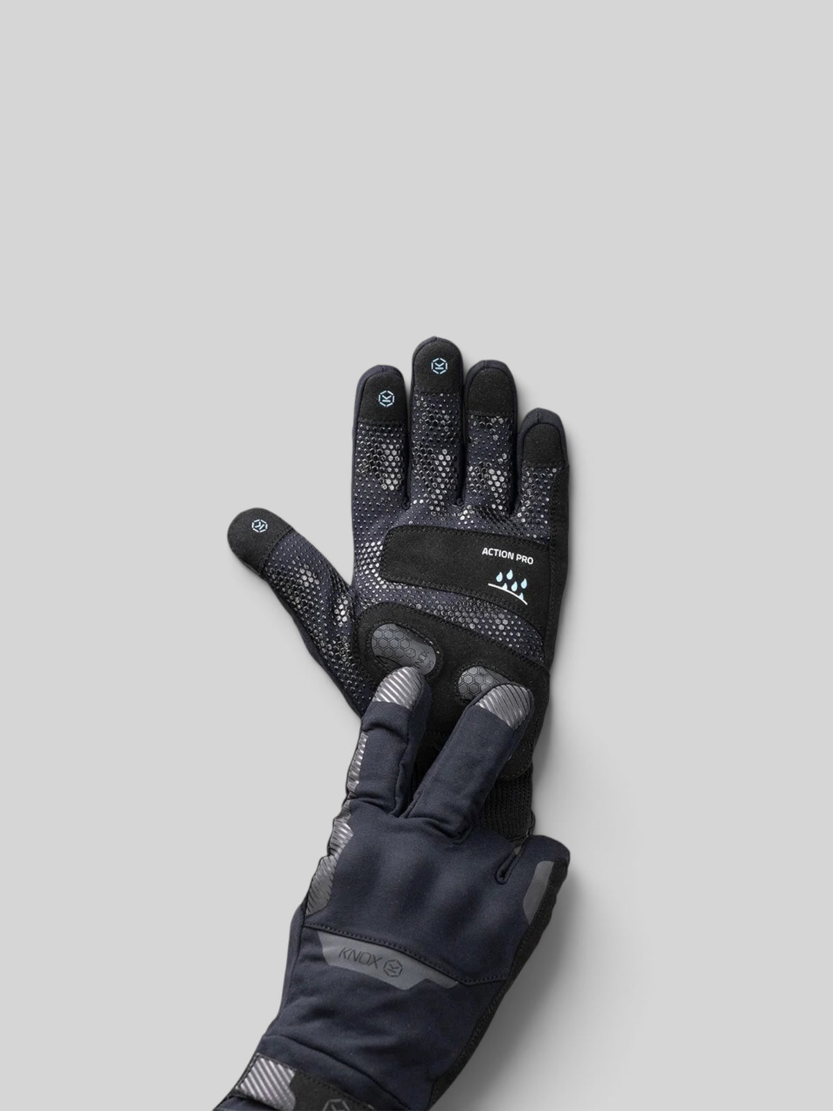 Baffle Haus Action Pro waterproof motorcycle glove in black with silicone grip, knuckle protection, and touch screen.