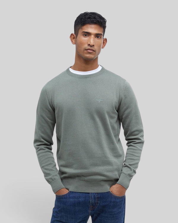 Baffle Haus agave green Pima cotton crew neck sweater with embroidered logo on chest worn by a male model