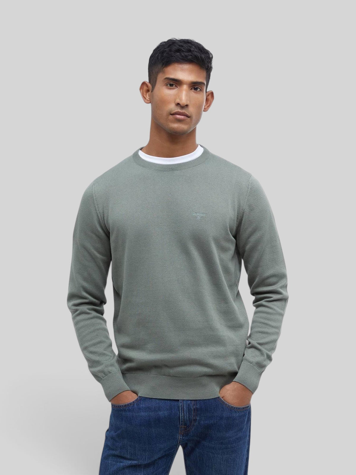 Baffle Haus agave green Pima cotton crew neck sweater with embroidered logo on chest worn by a male model