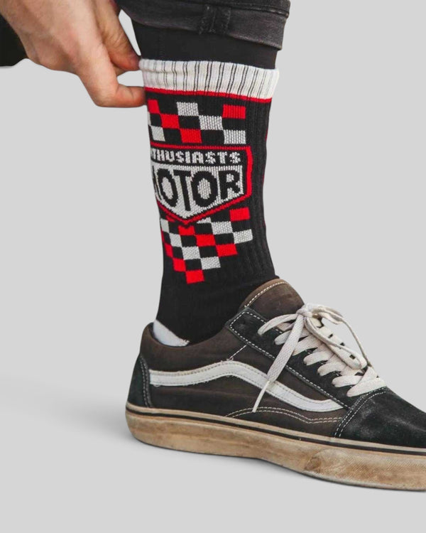 Baffle Haus Age Of Glory Enthusiasts socks in black, red, and off-white with checkered moto-inspired graphic design