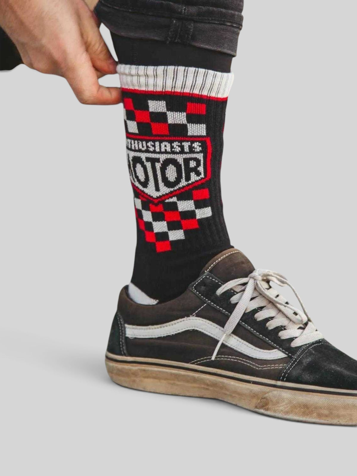 Baffle Haus Age Of Glory Enthusiasts socks in black, red, and off-white with checkered moto-inspired graphic design