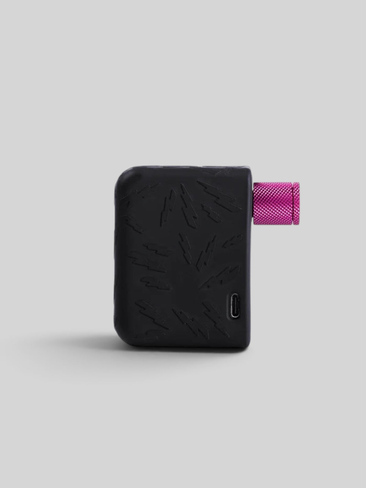 Baffle Haus AirMach Electric Pro Inflator in black with lightning bolt pattern and a metallic pink valve head.