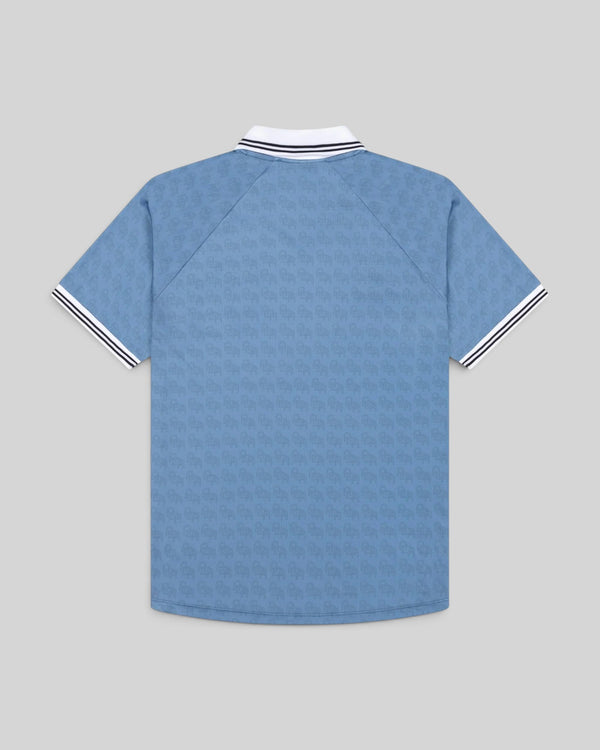 Baffle Haus Alma De Ace light blue football away top with white and black striped collar and sleeve cuffs