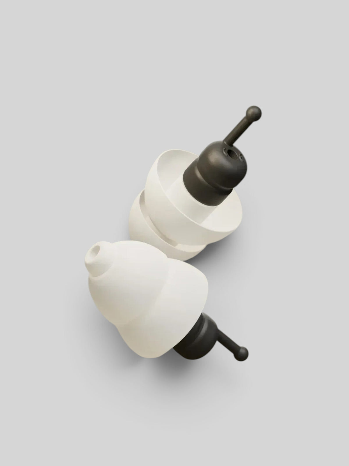 Baffle Haus Alpine MotoSafe Tour earplugs with white silicone flanges and black acoustic filters for motorcycle use