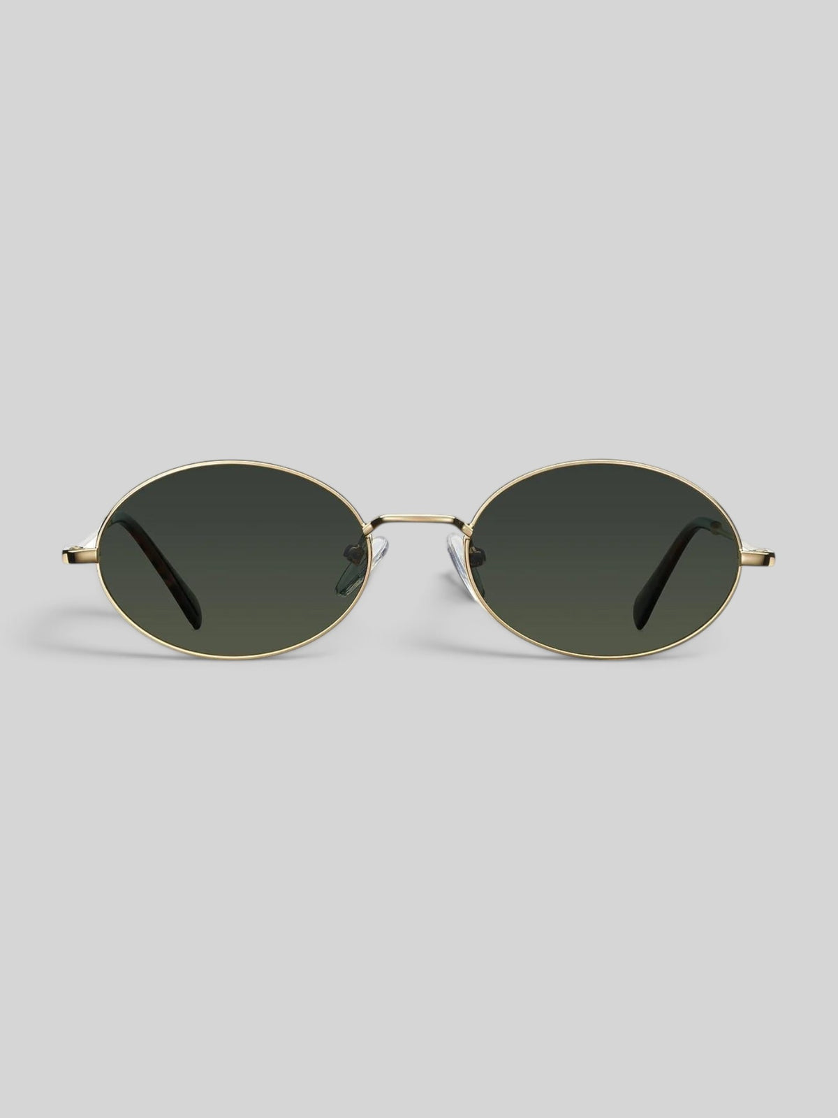 Baffle Haus Amara oval sunglasses with a slim gold stainless steel frame and dark polarized lenses.