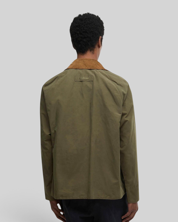 Back view of Baffle Haus Barbour Icons Transport casual jacket in ivy green with a brown corduroy collar.