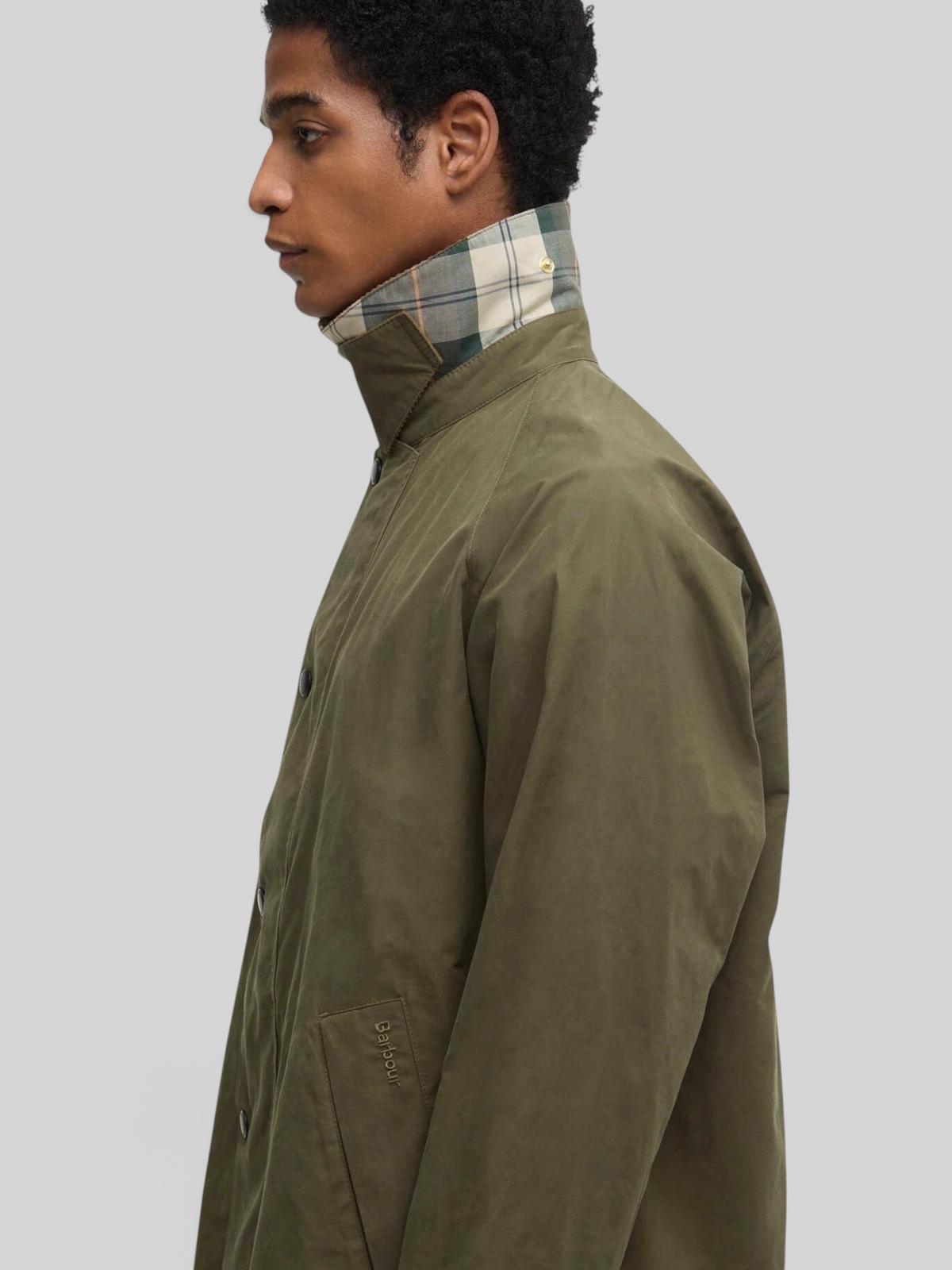 Baffle Haus Barbour Icons Transport casual jacket in ivy green with a signature tartan cord collar and side view.