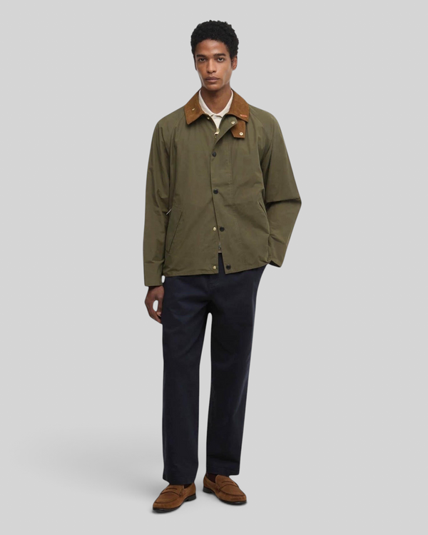 Baffle Haus Barbour Icons Transport casual jacket in ivy green with a brown corduroy collar worn by a male model.
