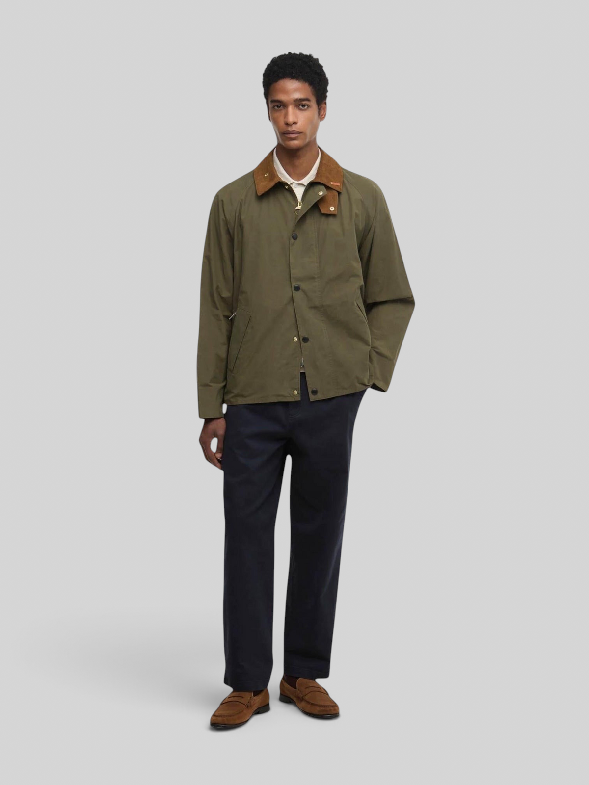 Baffle Haus Barbour Icons Transport casual jacket in ivy green with a brown corduroy collar worn by a male model.