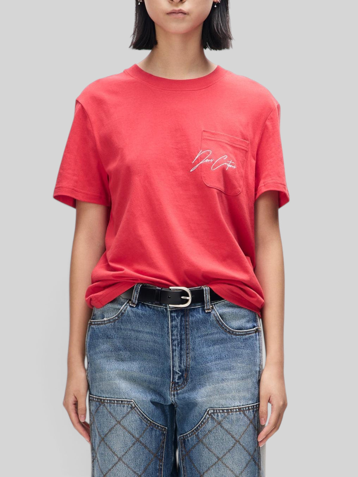 Baffle Haus Bird Scratch Tee in poinsettia red, featuring a chest pocket with white embroidery and a classic fit.