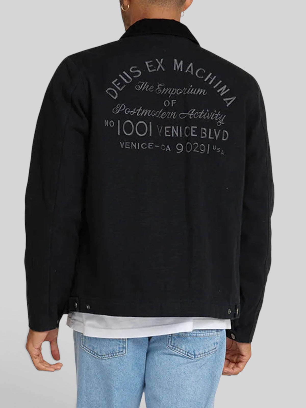 Baffle Haus black cotton canvas workwear jacket with embroidered Deus Ex Machina address on the back