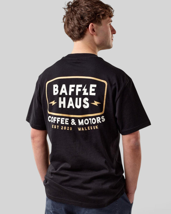 Baffle Haus black cotton t-shirt with Coffee & Motors graphic print on the back worn by a man