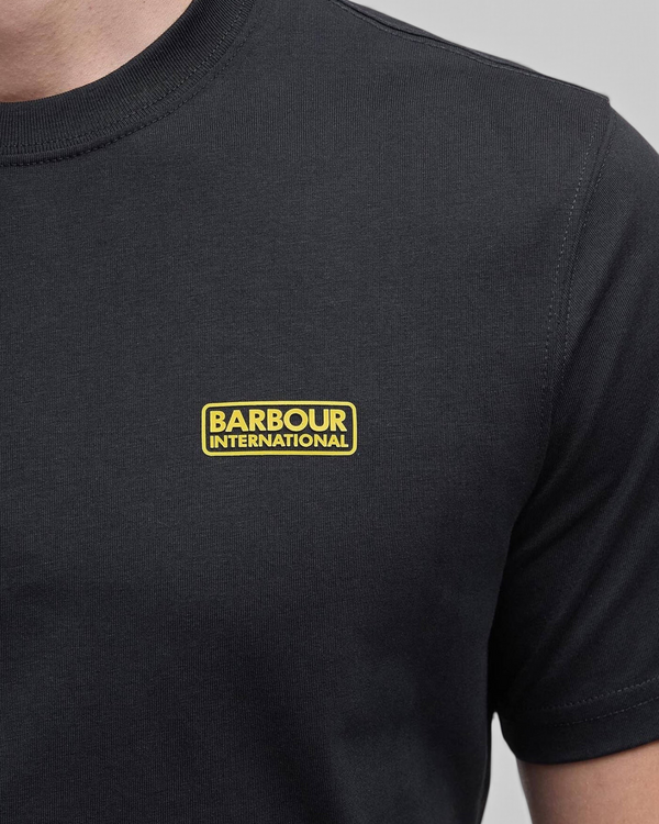 Baffle Haus black cotton crew neck T-shirt featuring a yellow Barbour International logo on the chest