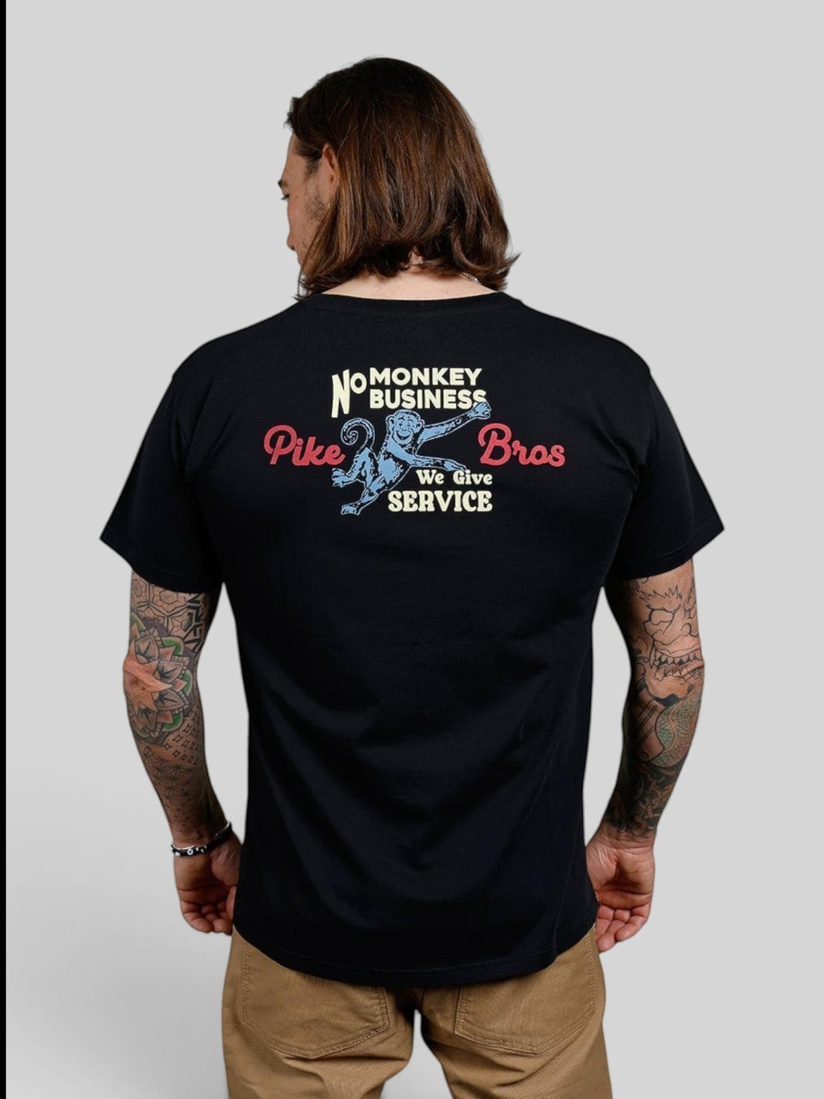 Baffle Haus black 100% cotton t-shirt with vintage 1960s style monkey graphic print on the back