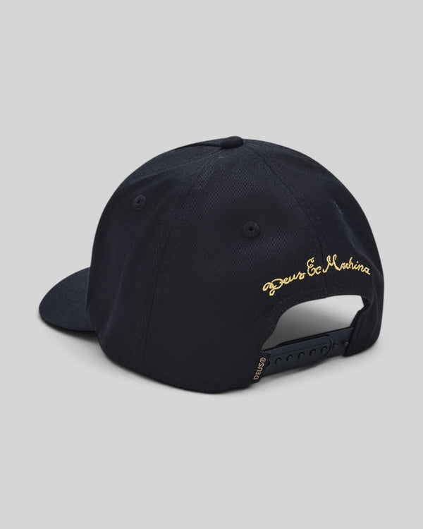 Baffle Haus black cotton twill cap with gold embroidered Deus Ex Machina logo on the back and plastic snap closure.