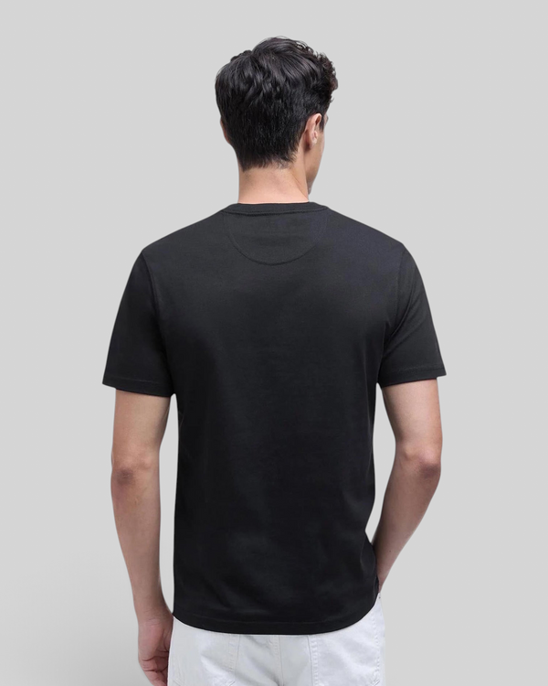 Back view of a man wearing a Baffle Haus black crew neck cotton t-shirt with a tailored fit.