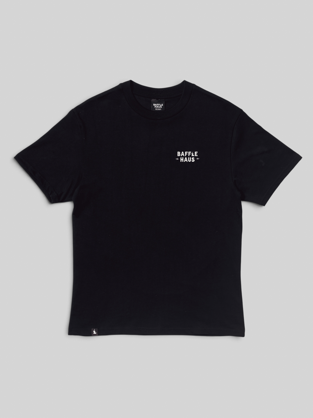 Baffle Haus black cotton t-shirt with small white chest logo and bottom hem detail