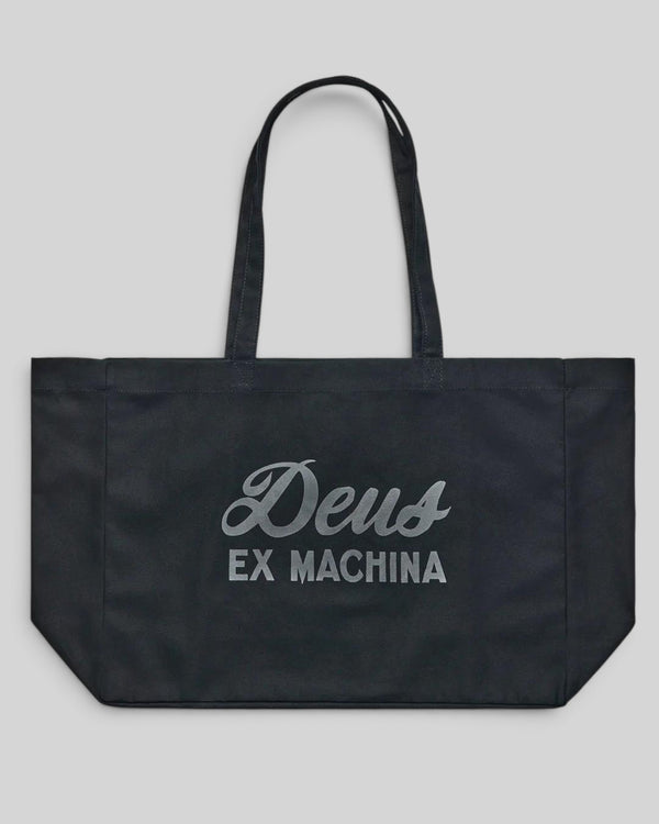 Baffle Haus black cotton twill tote bag featuring the white Deus Ex Machina logo and twin shoulder straps.
