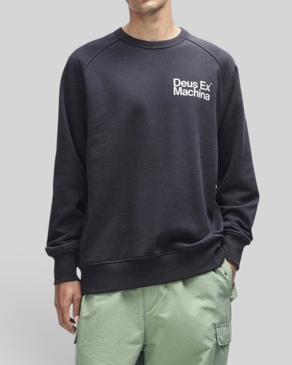 Baffle Haus Plenty Good crew neck fleece in black with white chest logo and nylon sleeve panels on a model