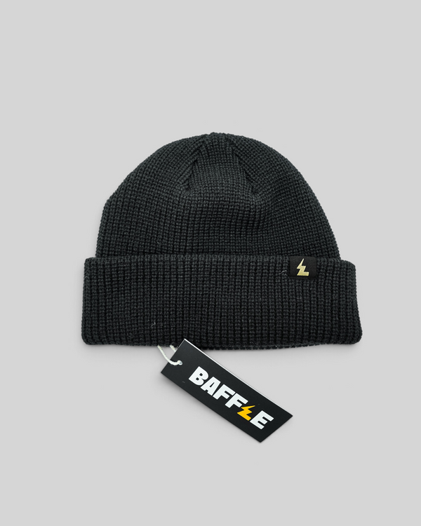 Baffle Haus black fisherman beanie with a short cuff and woven logo label on a white background