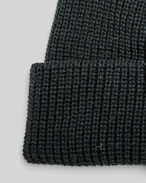 Baffle Haus black fisherman beanie with a short-cuff design and durable ribbed acrylic knit texture.
