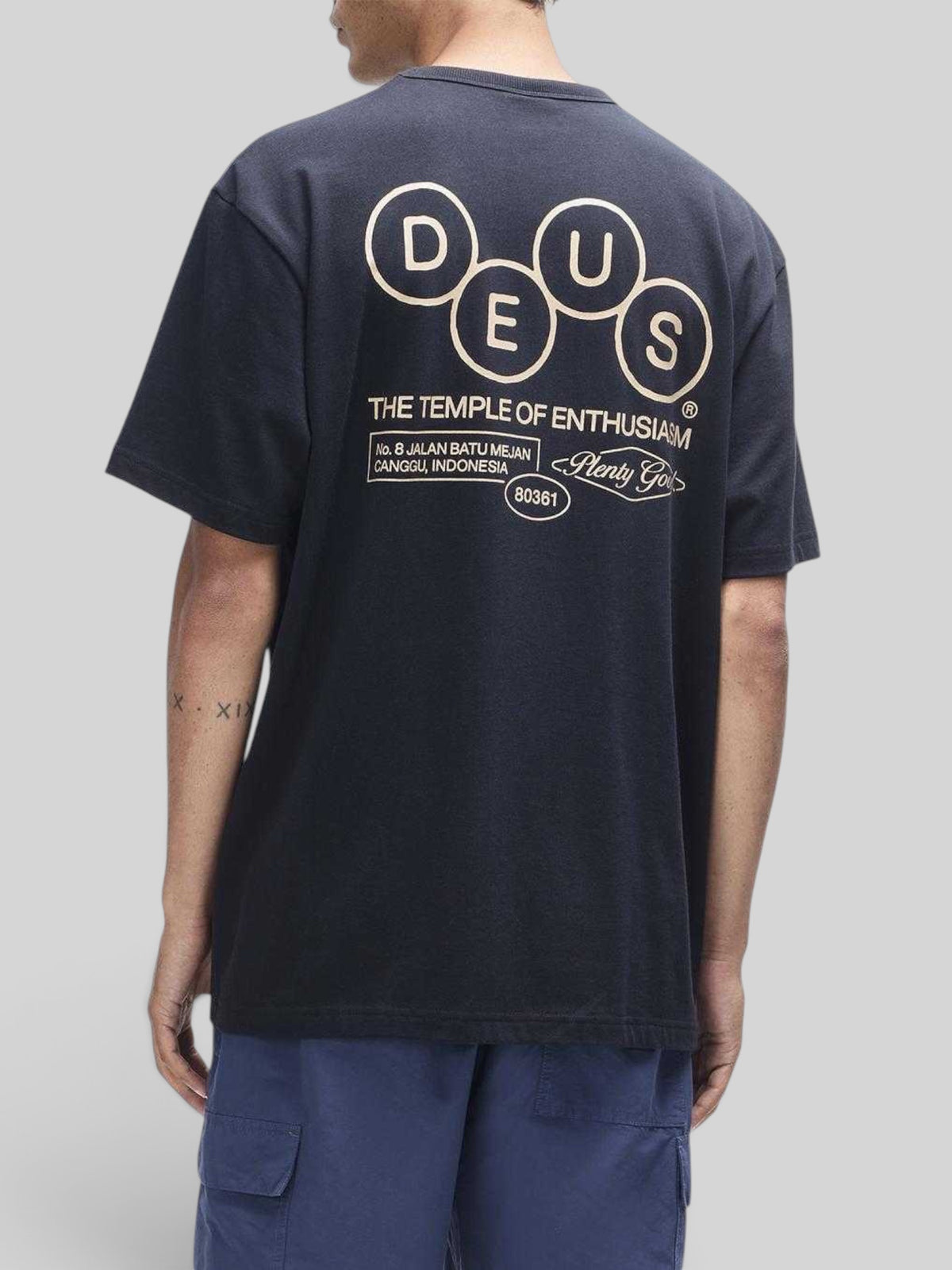 Baffle Haus black short sleeve cotton t-shirt with graphic print on back featuring circular logo and text
